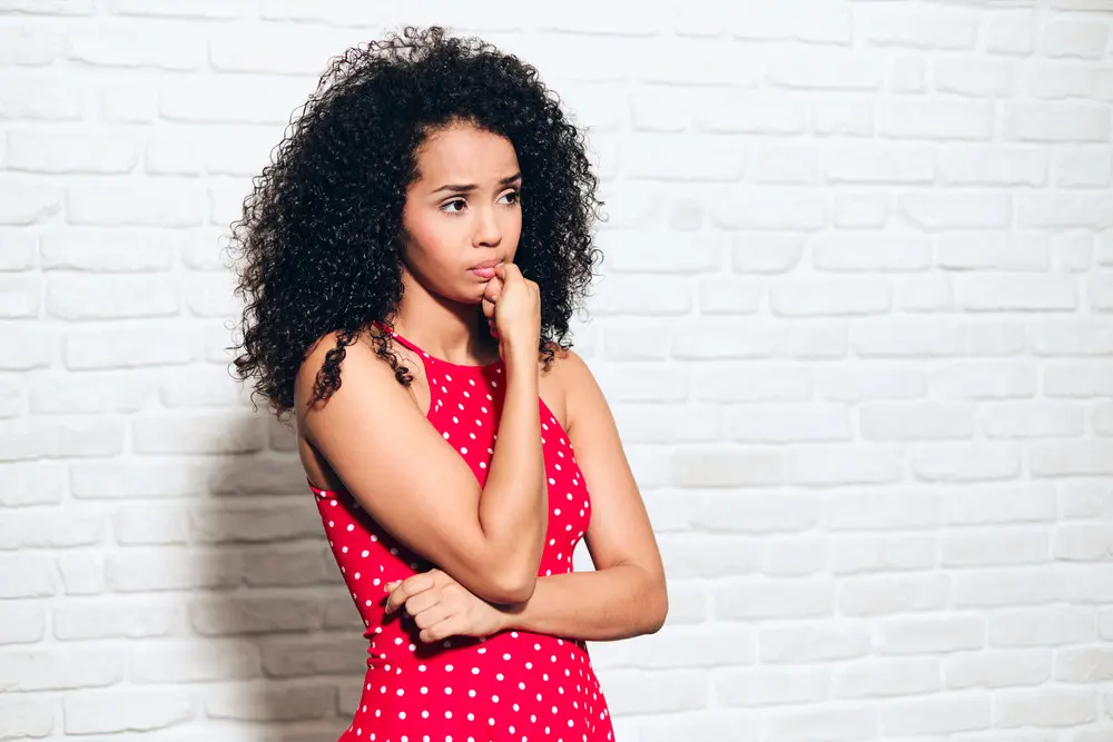 Worried Young African American Woman Biting Nails For Sadness Anxiety